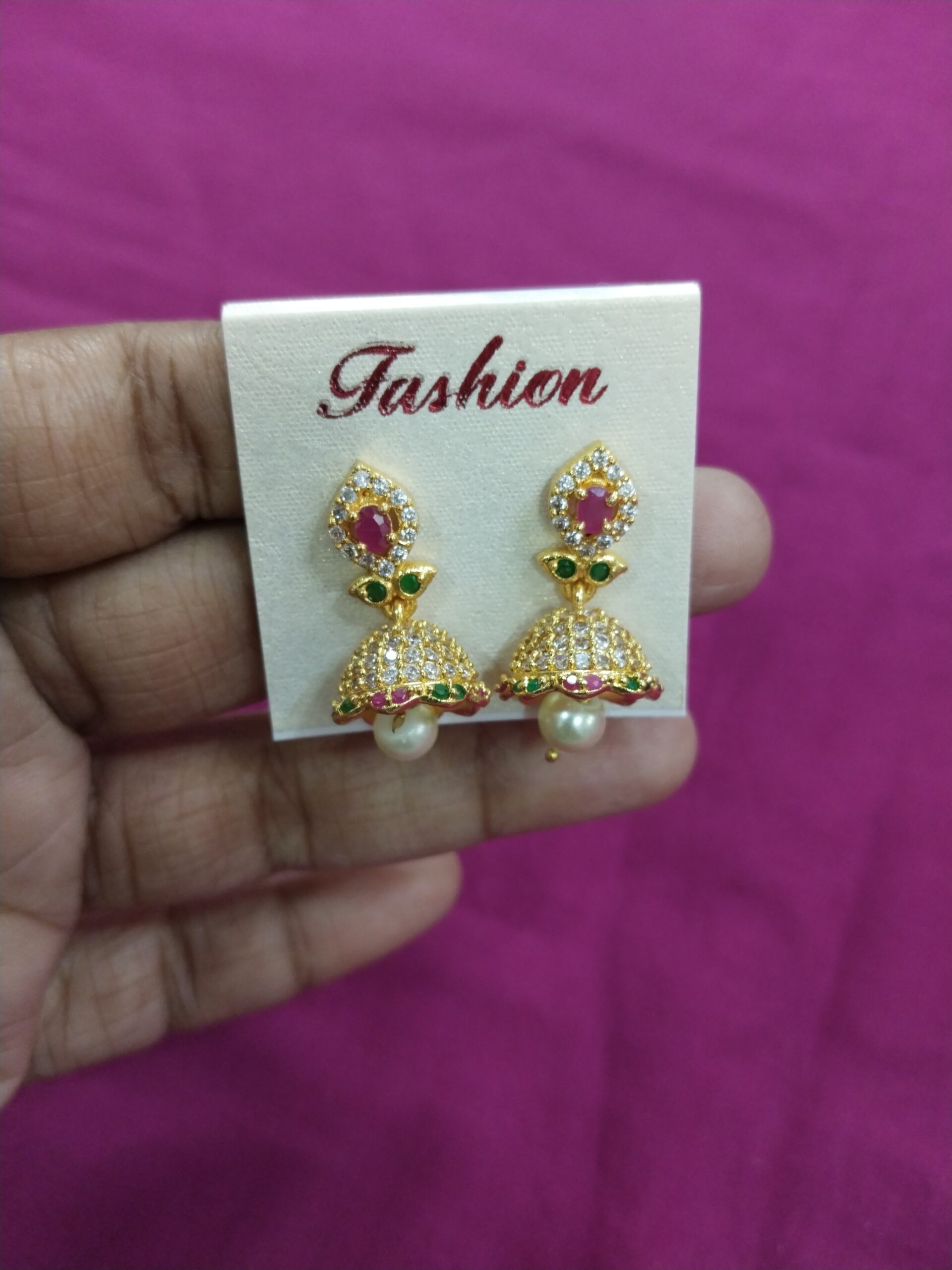 Ethnic Pearl Drop Earrings with Pink Center and Green Leaf Design