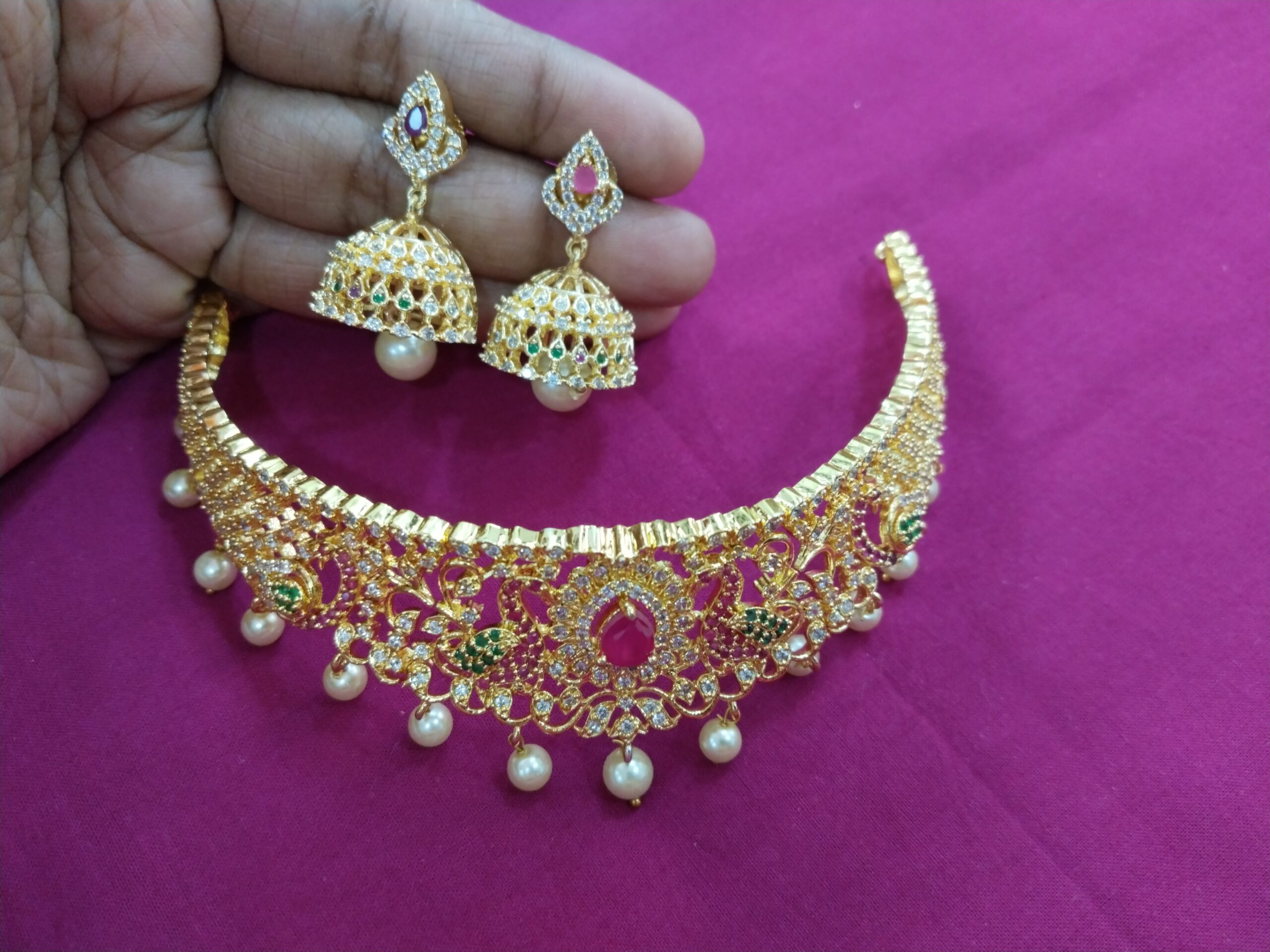 Gold Bridal Choker Set with Ruby Oval Centerpiece and Pearl Jhumka Earrings
