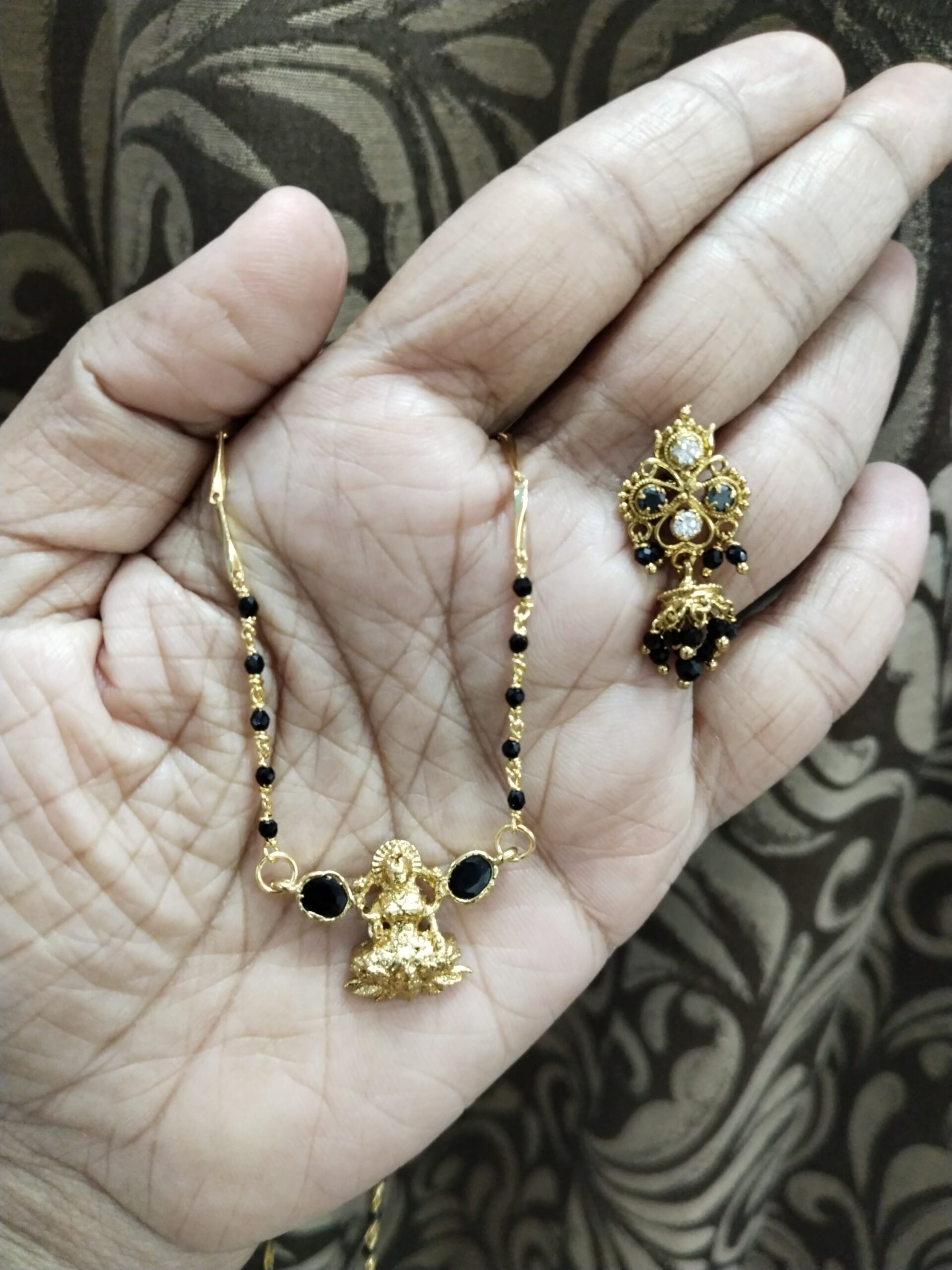 Gold-Plated Lakshmi Pendant Mangalsutra with Green CZ Stones and Multicolor Ear Cuff – Traditional Temple Jewelry Set for Women